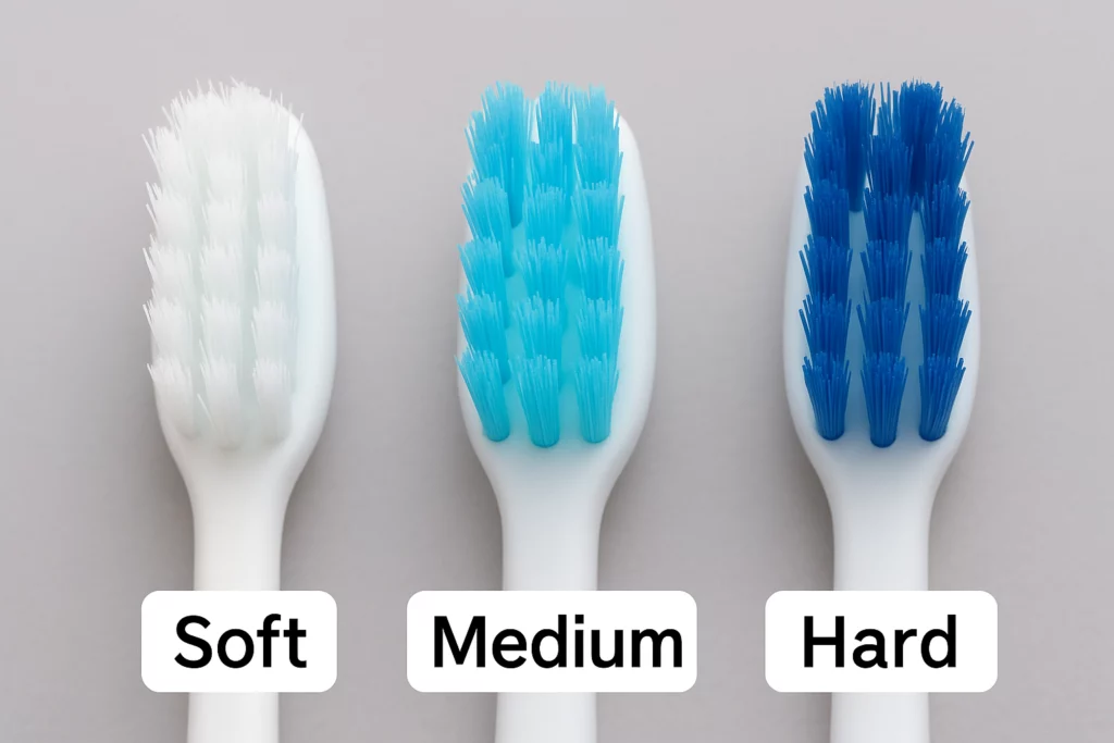 Close-up comparison of soft, medium, and hard bristles on manual toothbrushes.
