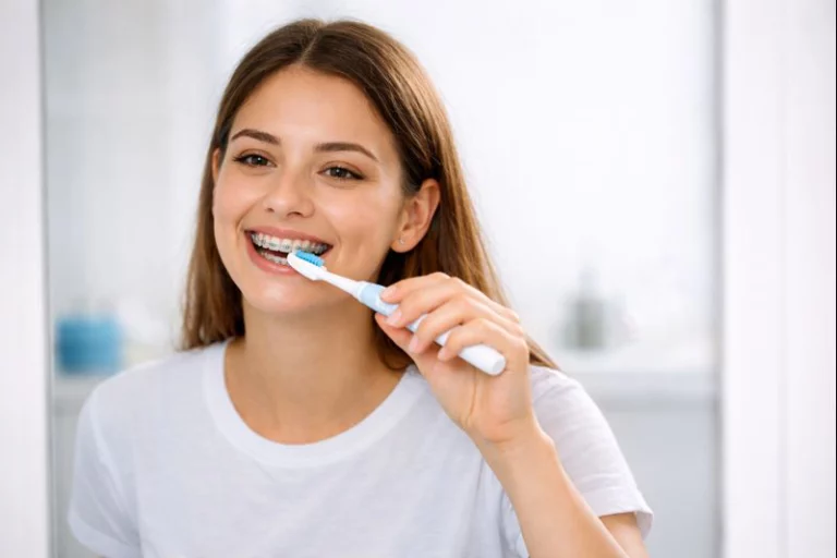 Oral care routine for braces patients brushing teeth with orthodontic toothbrush